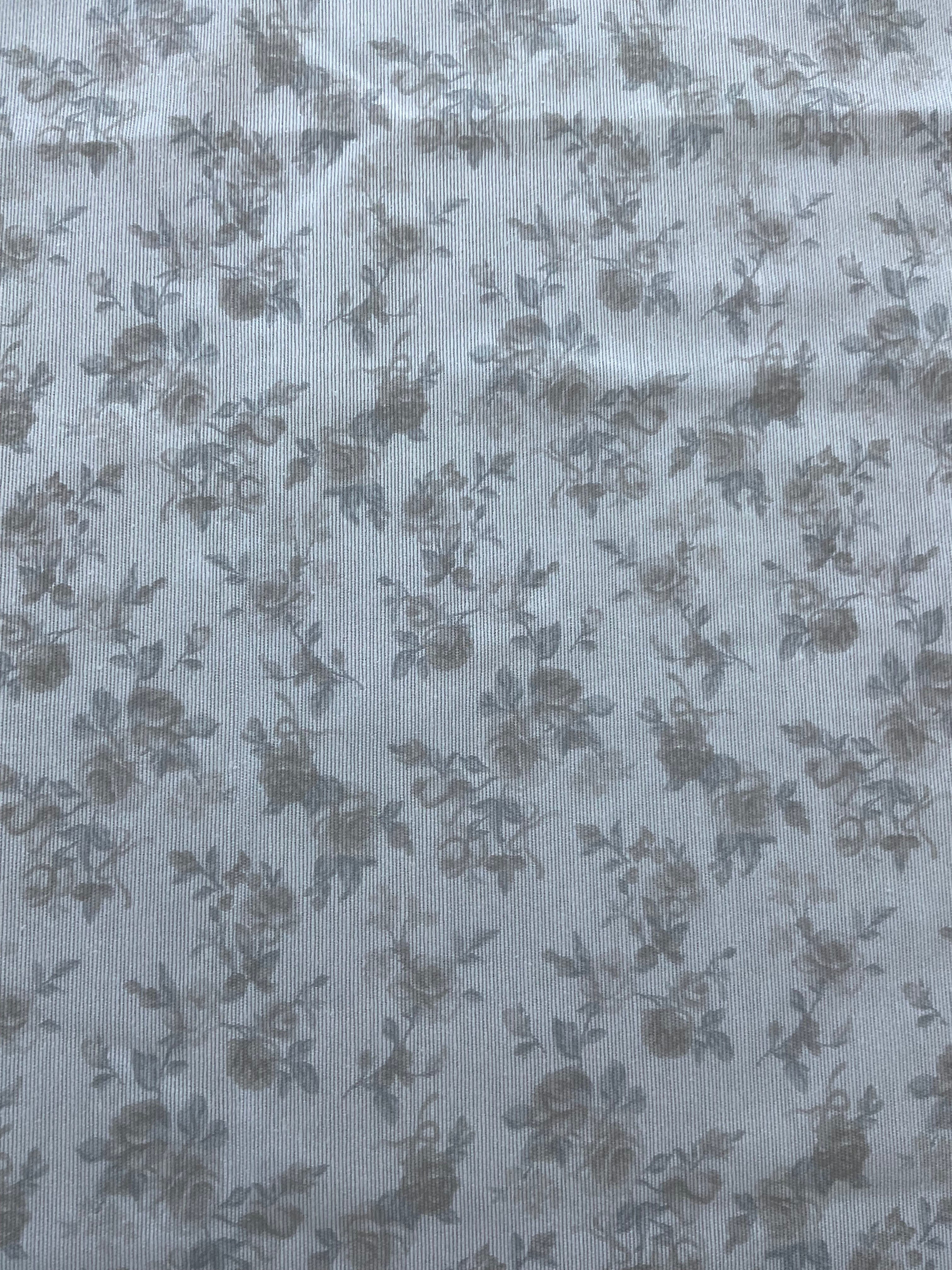 Beige tablecloth with delicate rose print and decorative hem