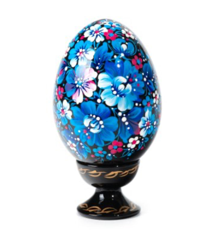 Blue Bloom wooden Ukrainian pysanka hand-painted with blue flowers in the Petrykivka tradition