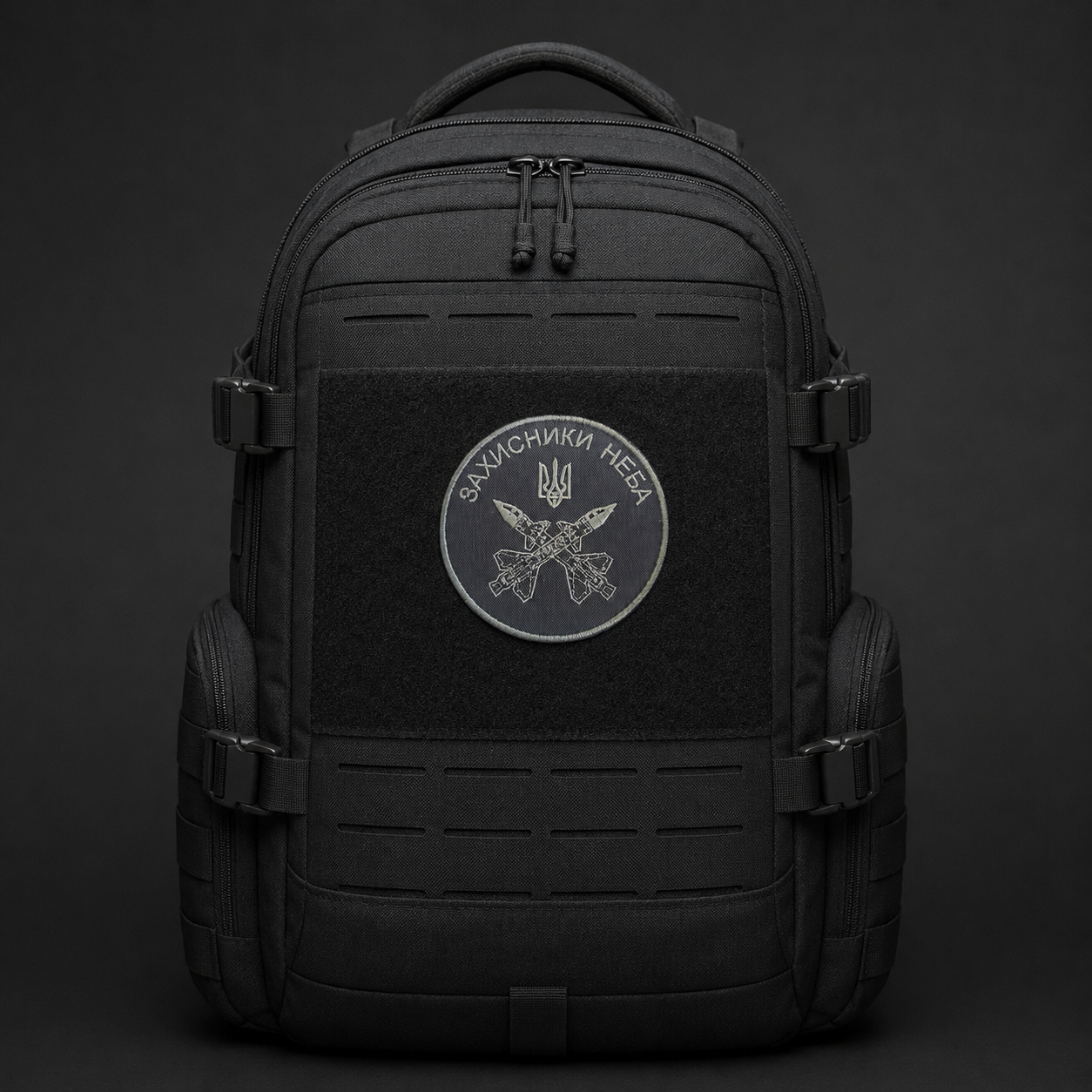 Defenders of the Sky air defence patch centred on a black tactical backpack