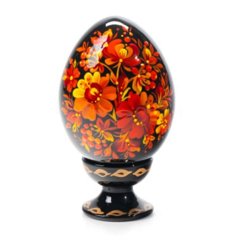 Fire Blossom wooden Ukrainian pysanka hand-painted with vibrant red and orange Petrykivka flowers