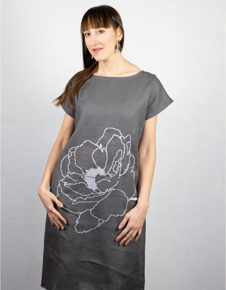 Woman wearing Flower linen tunic dress with white floral embroidery made in Ukraine