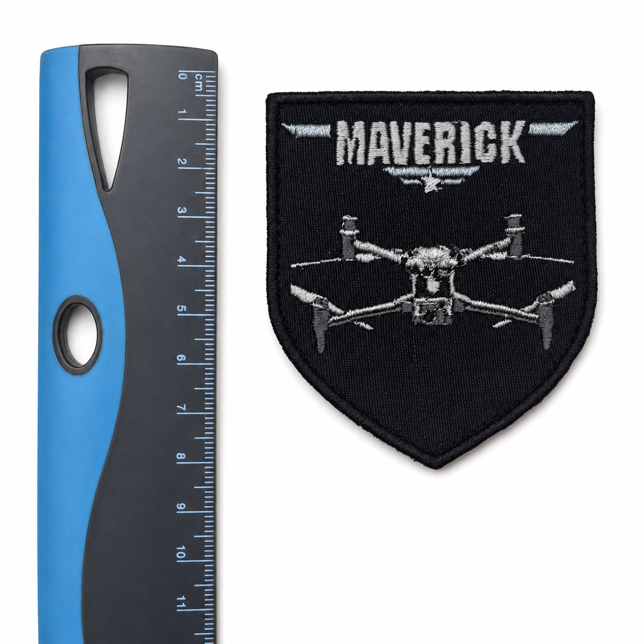 Maverick drone patch displayed beside a ruler for size reference