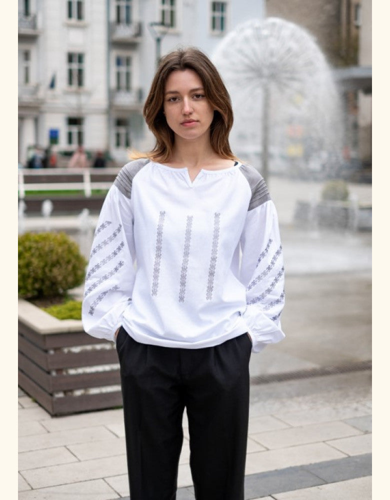 Woman wearing Podillia women's white linen vyshyvanka with grey embroidery made in Ukraine