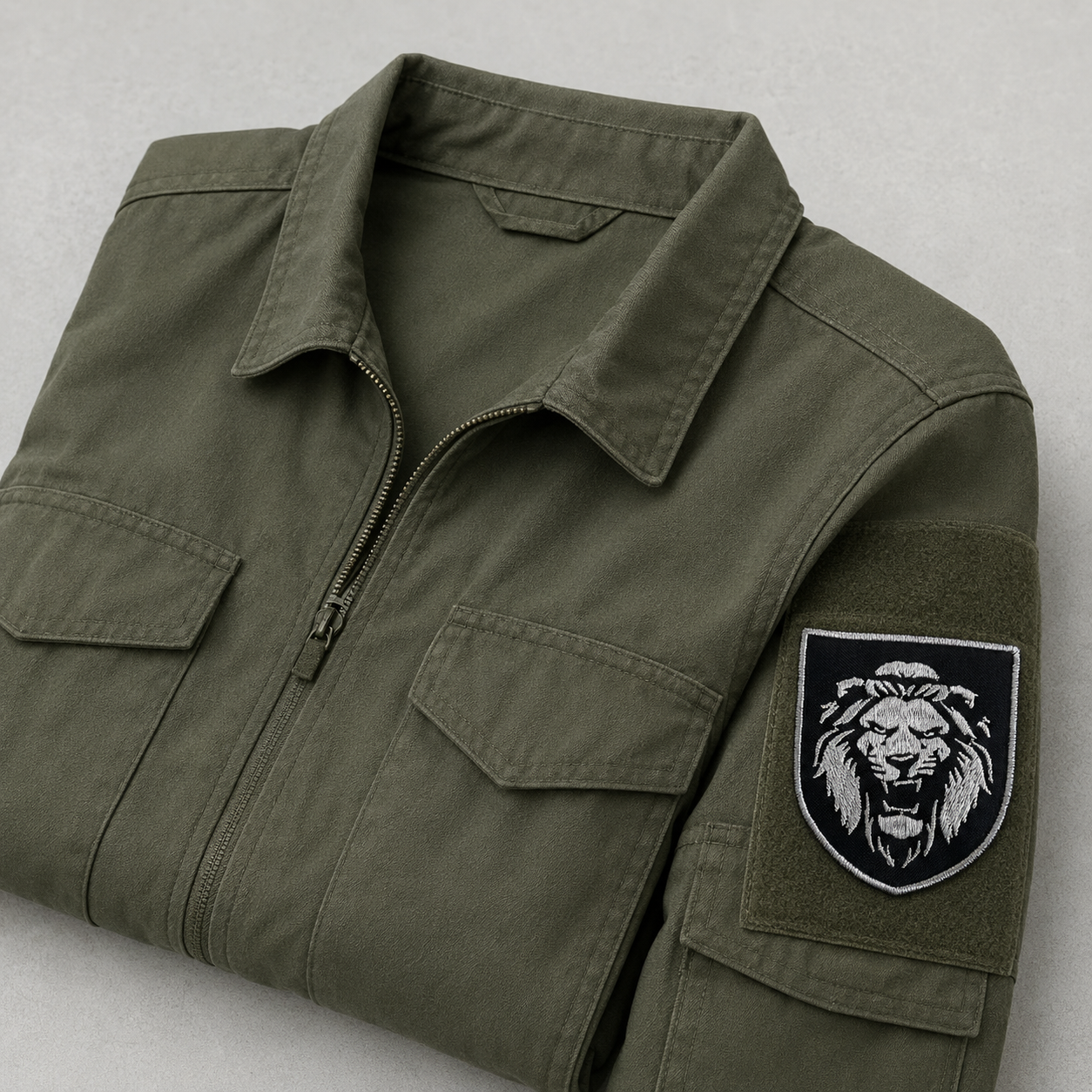 Ukrainian lion morale patch attached to an olive field jacket