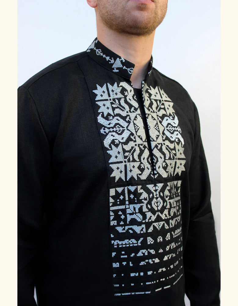 Men's Ukrainian embroidered shirt featuring traditional star motifs on black linen