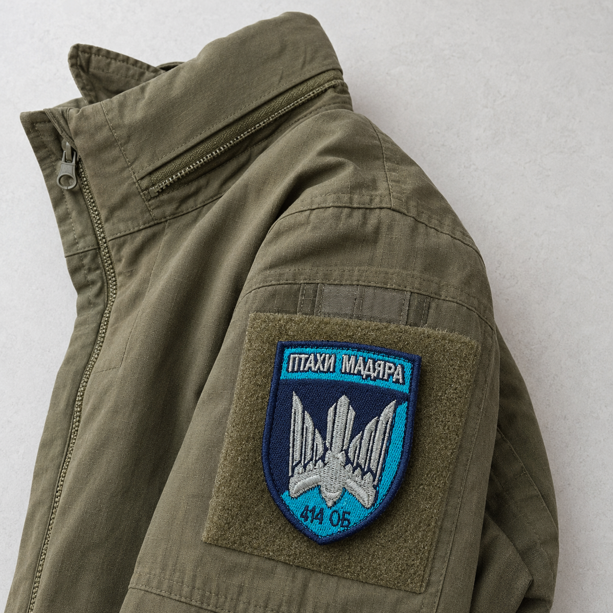 Birds of Magyar Ukrainian drone brigade patch attached to an olive field jacket