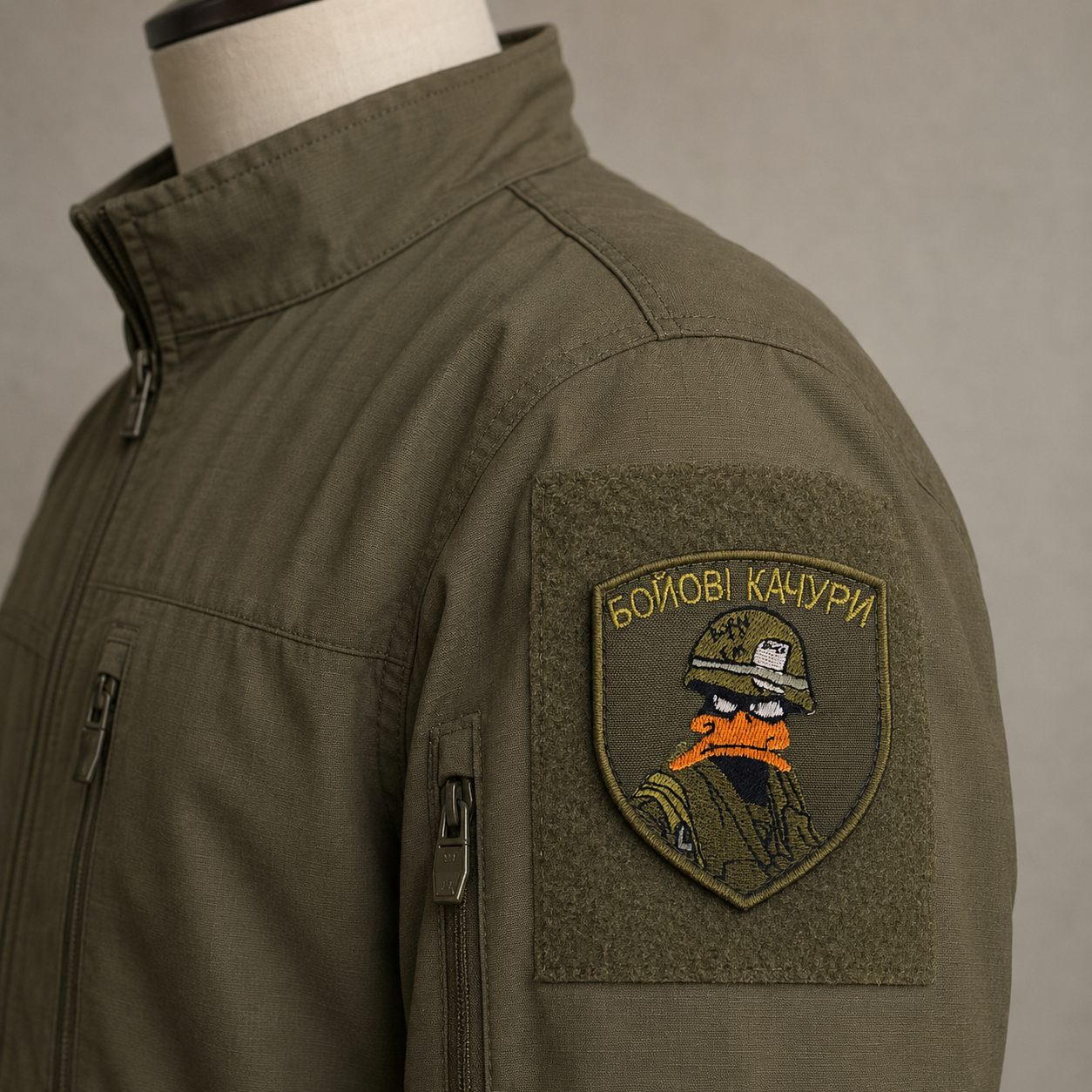 Бойові Качури Combat Ducks patch displayed on an olive tactical jacket