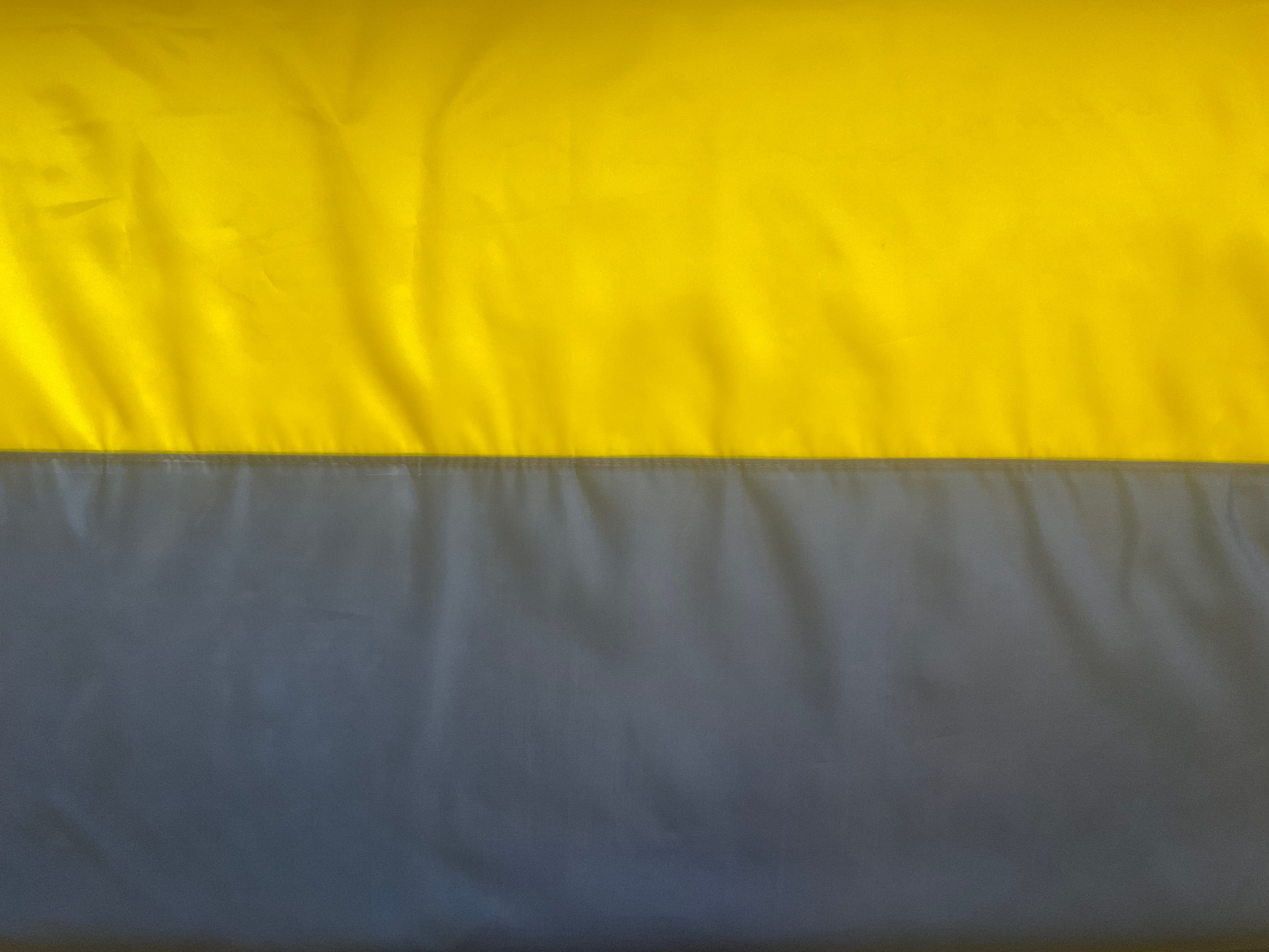 dark blue Ukrainian flag with sewn pole sleeve