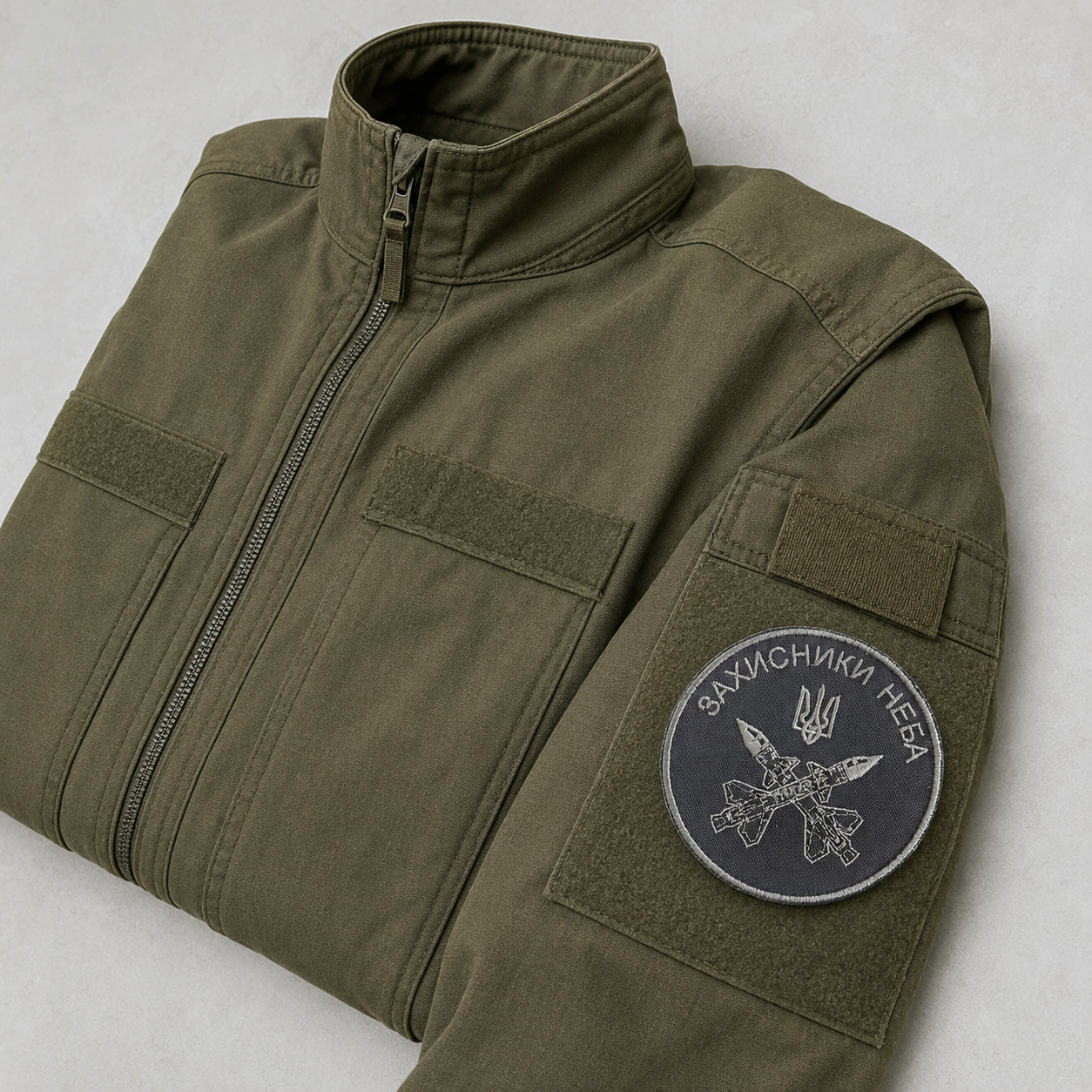 Defenders of the Sky Ukrainian air defence patch attached to an olive field jacket