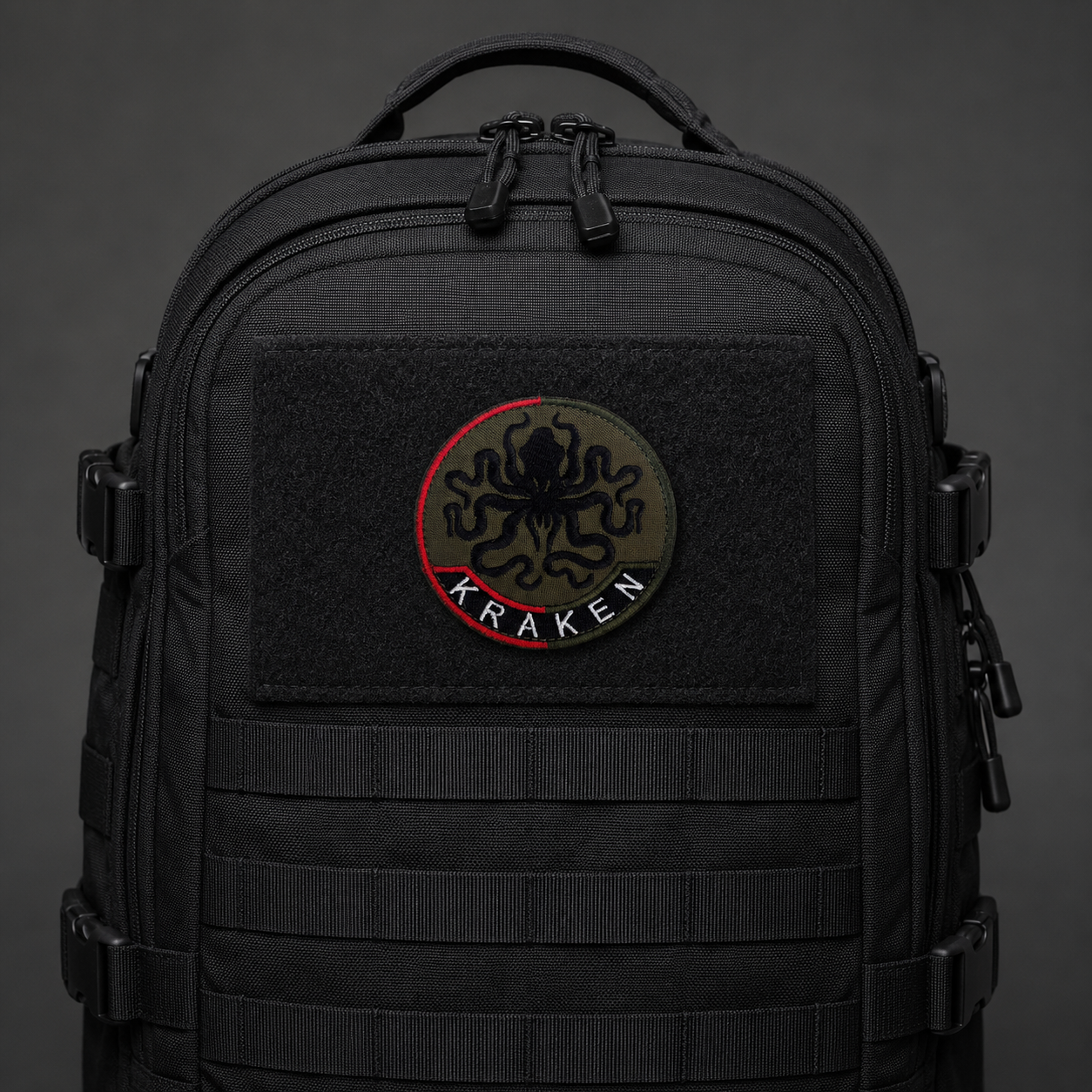 Ukrainian Kraken octopus morale patch centred on a black tactical backpack