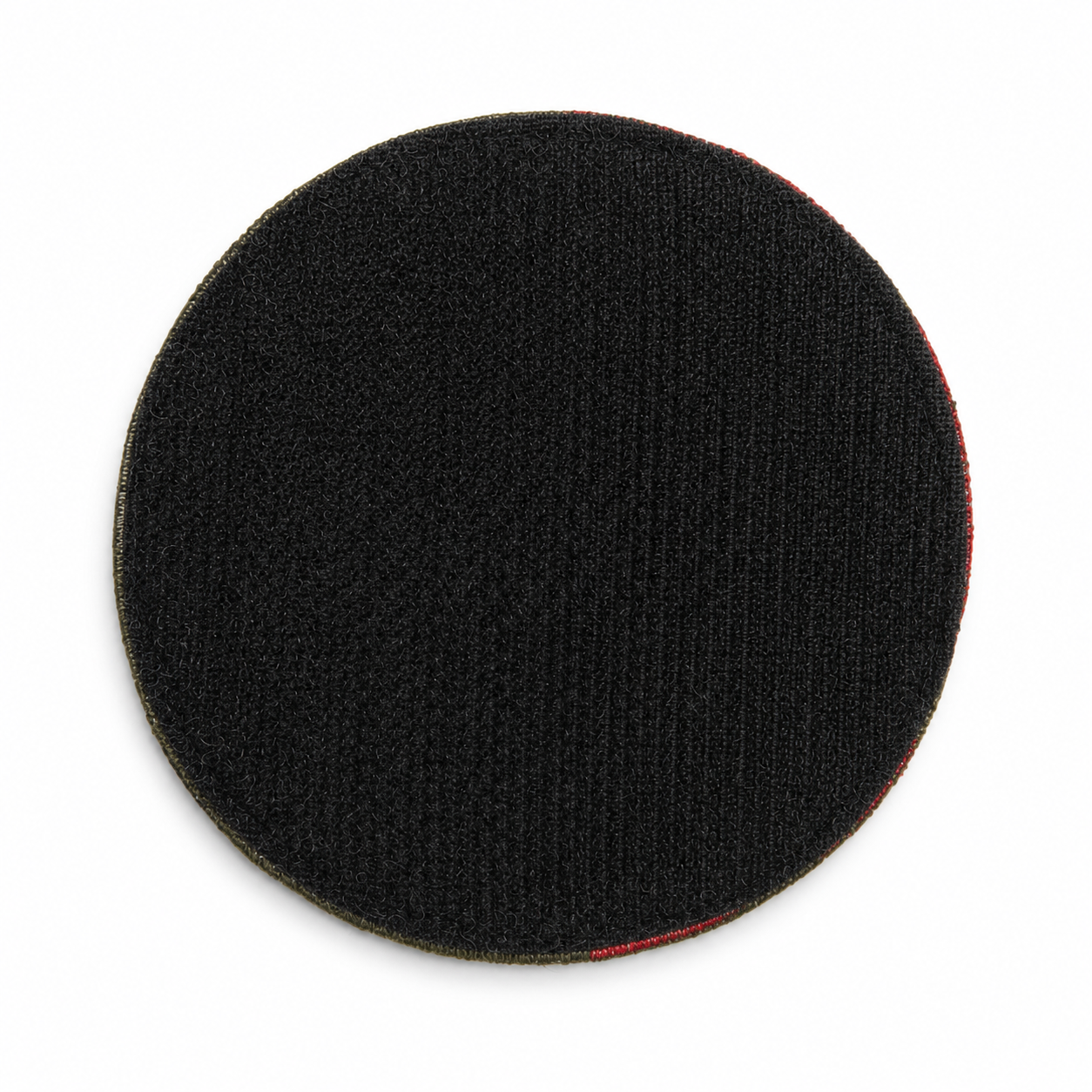 Back of the round Kraken patch showing the full black hook-and-loop backing