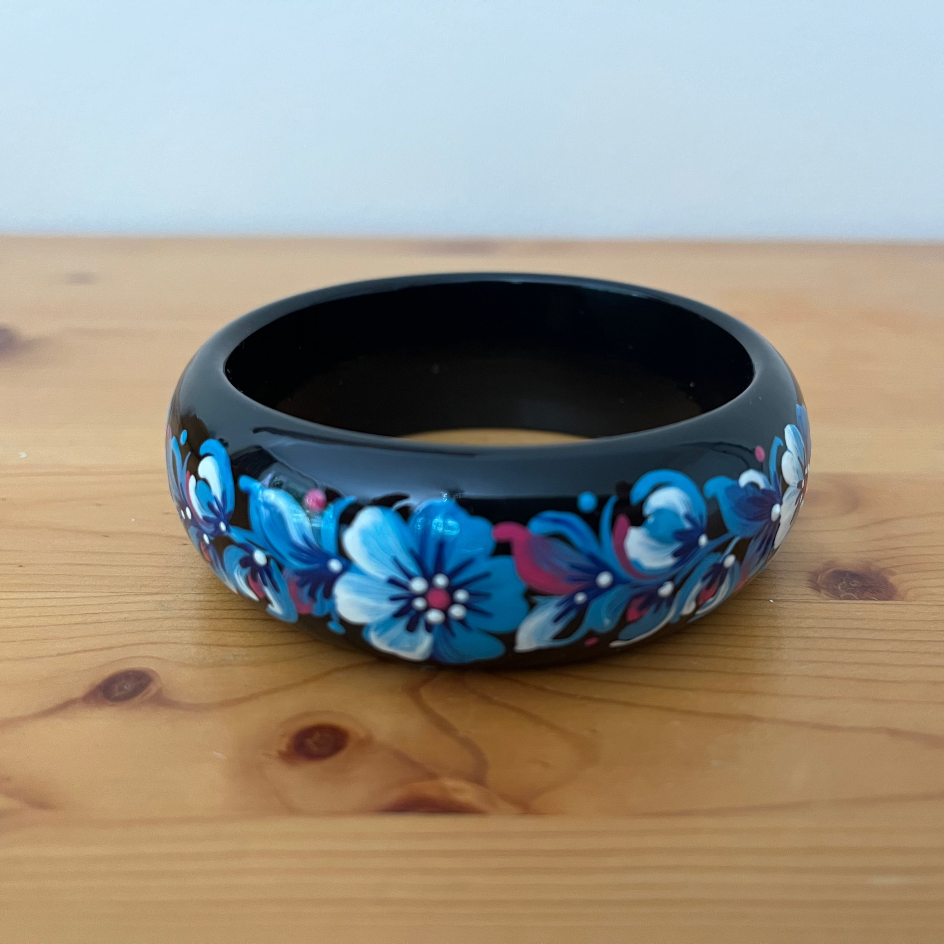 Made in Ukraine wooden bracelet with elegant blue Petrykivka floral design