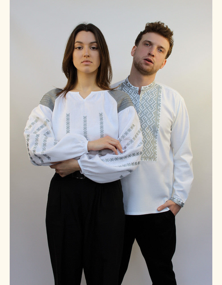Man and woman wearing matching Ukrainian embroidered linen shirts for couples