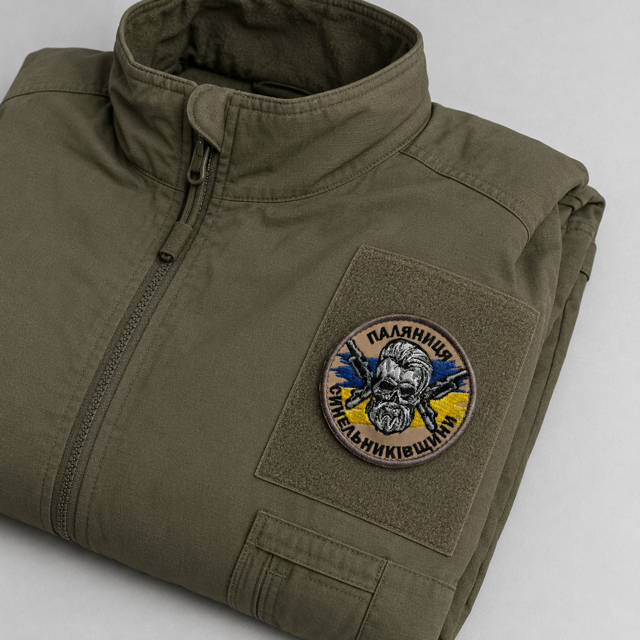 Palianytsia of Synelnykivshchyna volunteer patch attached to an olive field jacket