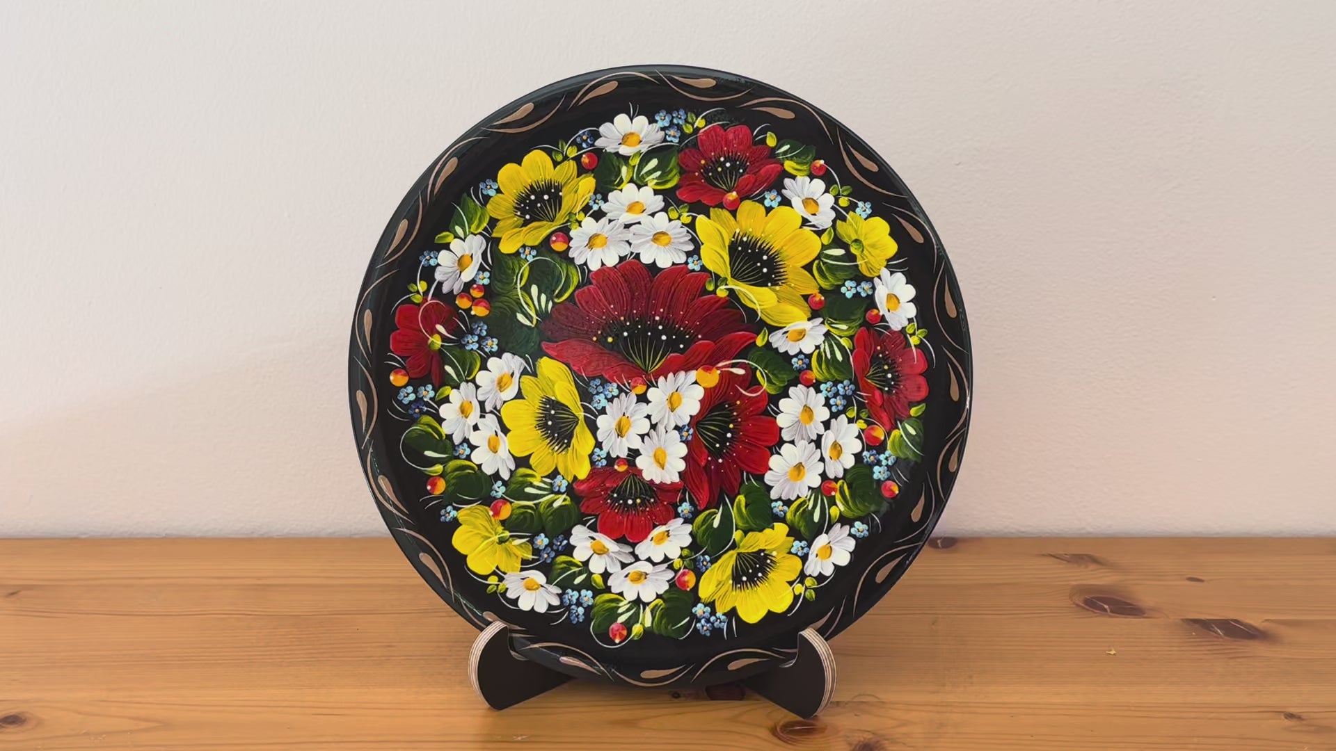 Hand-painted Petrykivka decorative plate with red poppies, white daisies, and yellow flowers – authentic Ukrainian folk art handmade in Ukraine