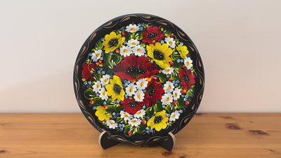 Hand-painted Petrykivka decorative plate with red poppies, white daisies, and yellow flowers – authentic Ukrainian folk art handmade in Ukraine