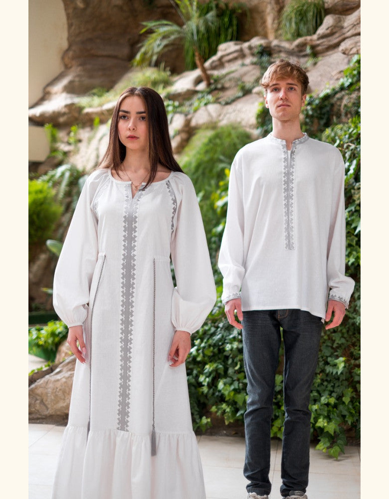 Traditional white Ukrainian vyshyvanka dress featuring delicate silver embroidery