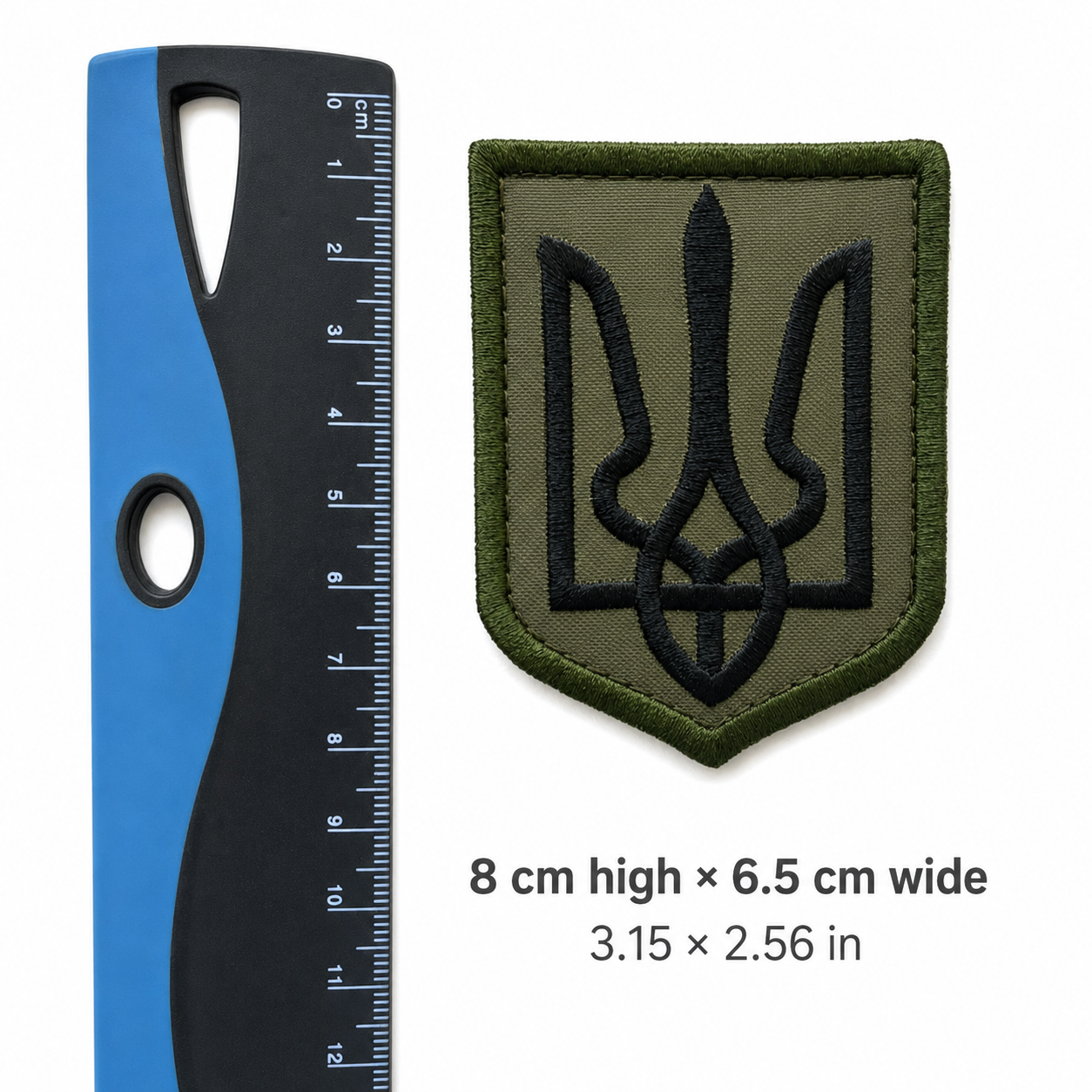 Olive Ukrainian Tryzub tactical patch shown beside a centimetre ruler